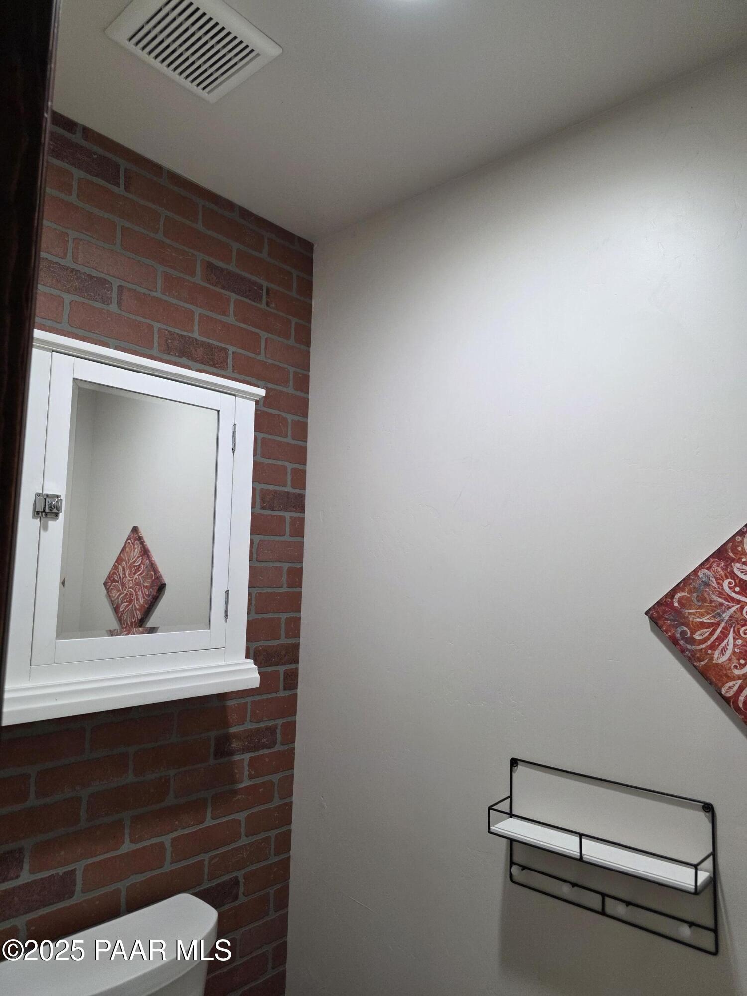 17180 West Model Creek Road Kirkland, AZ 86332 - Photo 32 of 53 a view of a bench in a room