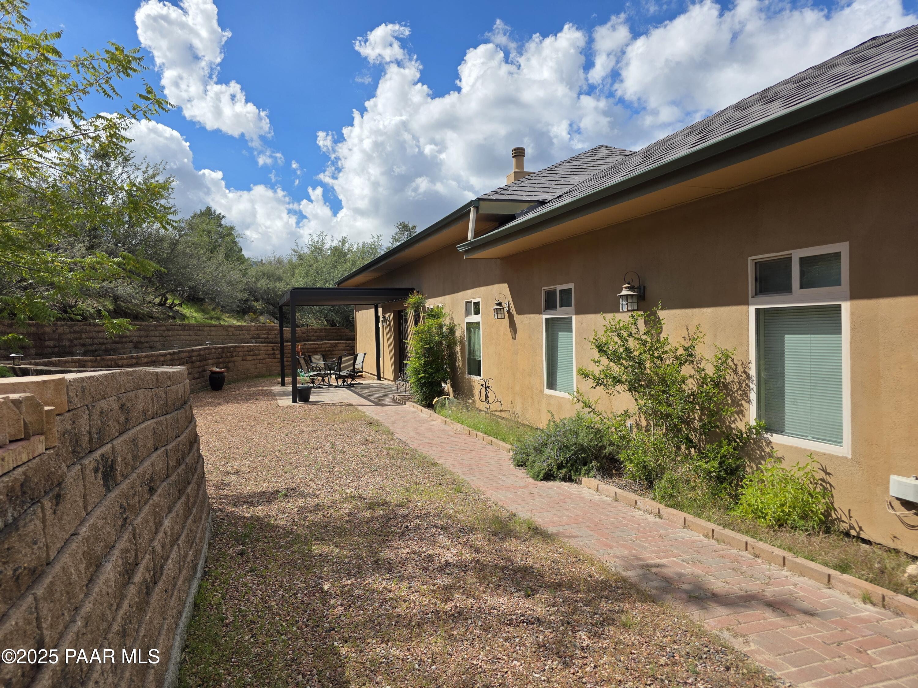 17180 West Model Creek Road Kirkland, AZ 86332 - Photo 4 of 53 a house view with a garden space