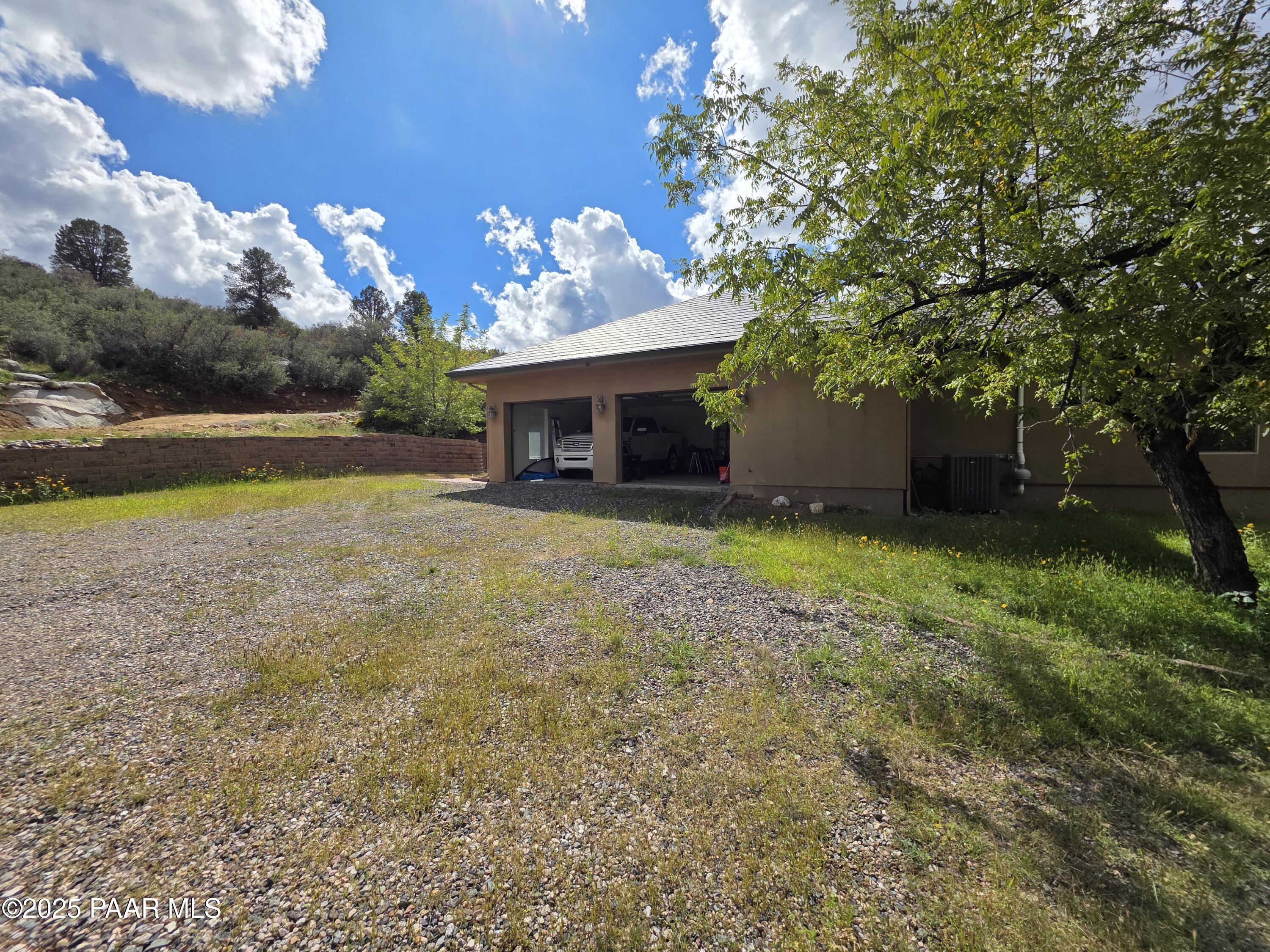 17180 West Model Creek Road Kirkland, AZ 86332 - Photo 42 of 53 a view of a house with a yard and tree s