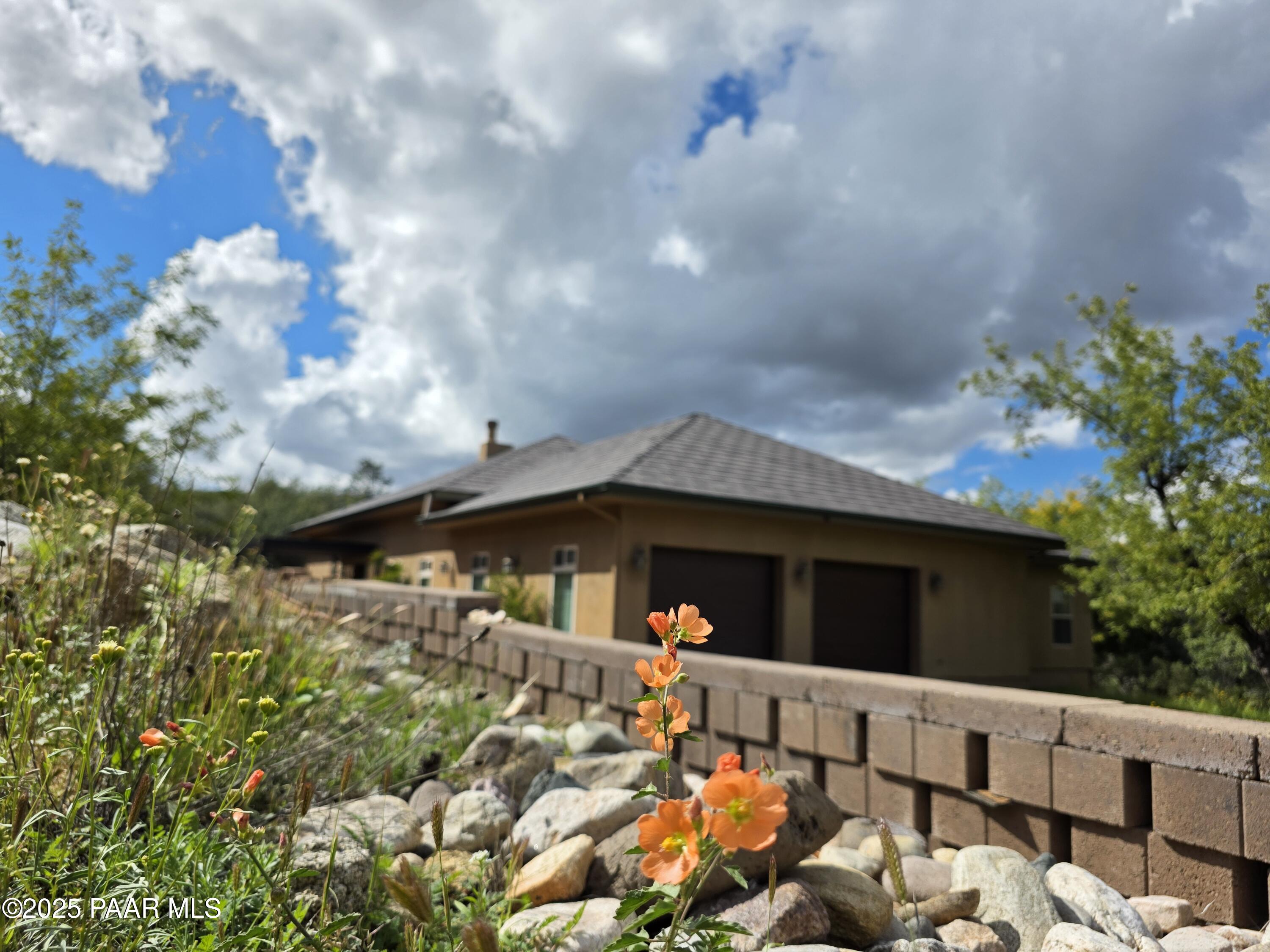 17180 West Model Creek Road Kirkland, AZ 86332 - Photo 43 of 53 a view of a patio with table and chairs and potted plants