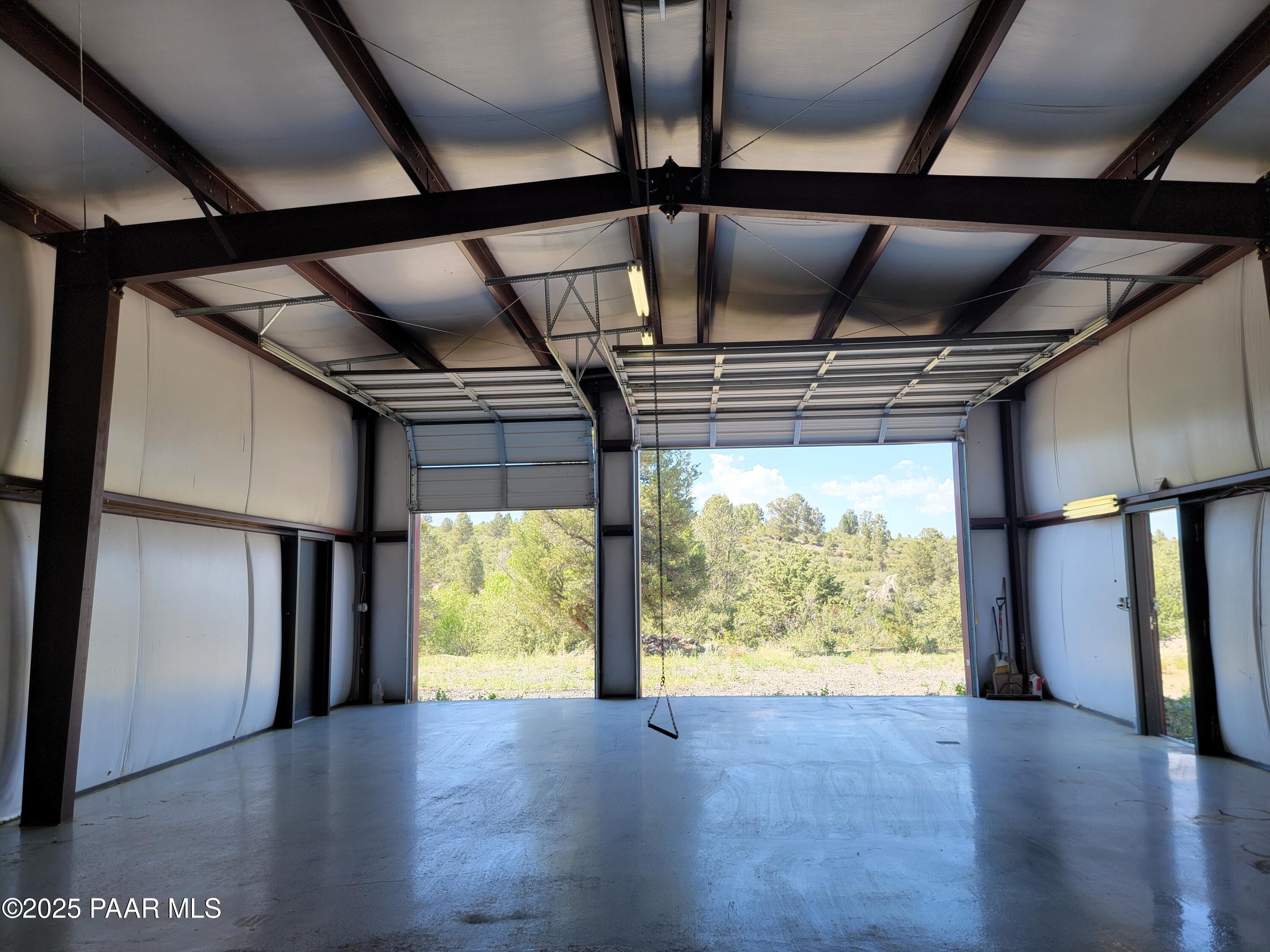 17180 West Model Creek Road Kirkland, AZ 86332 - Photo 48 of 53 a view of empty room with wooden floor and fan