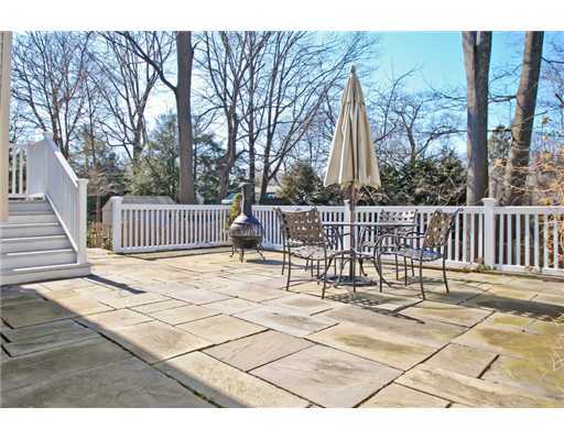 35 Walmsley Road Darien, CT 06820 - Photo 14 of 17 a view of a patio with a bench