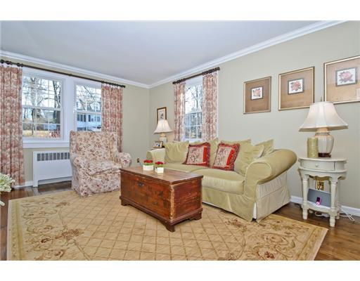 35 Walmsley Road Darien, CT 06820 - Photo 3 of 17 a living room with furniture and a flat screen tv