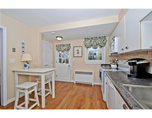 35 Walmsley Road Darien, CT 06820 - Photo 5 of 17 a kitchen with cabinets wooden floor and stainless steel appliances
