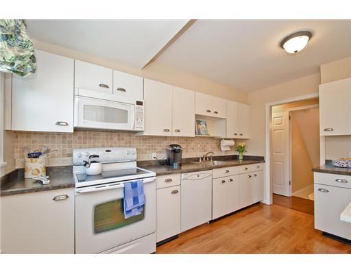 35 Walmsley Road Darien, CT 06820 - Photo 6 of 17 a kitchen with stainless steel appliances granite countertop a sink and cabinets