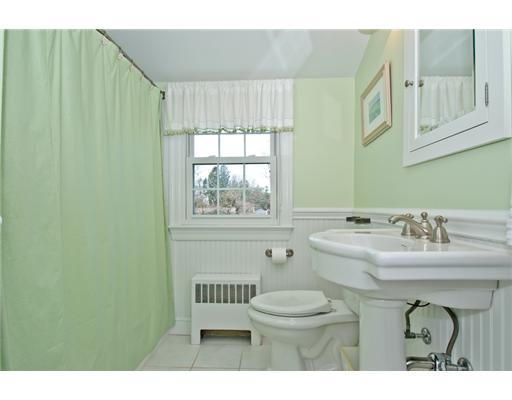 35 Walmsley Road Darien, CT 06820 - Photo 9 of 17 a bathroom with a sink toilet and window