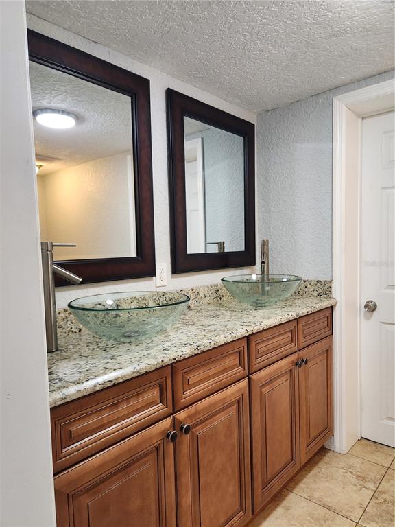 4425 Fairview Avenue Orlando, FL 32804 - Photo 14 of 16 a bathroom with mirror and vanity