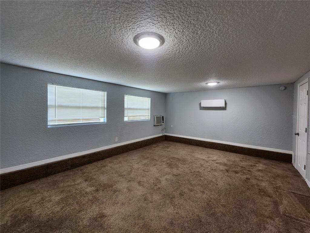 4425 Fairview Avenue Orlando, FL 32804 - Photo 4 of 16 an empty room with a window