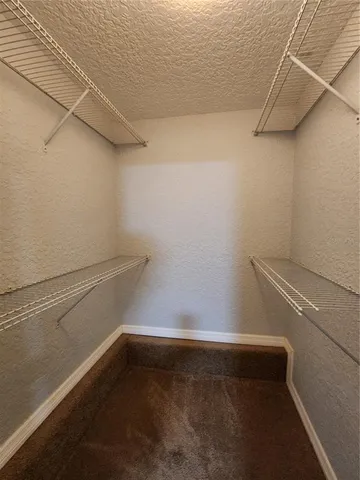 a view of a room with racks on the wall