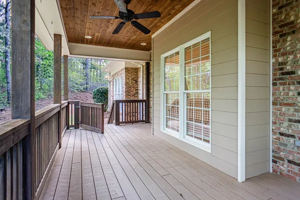 a view of a balcony with wooden floor