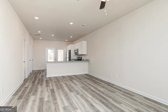 a view of kitchen and wooden floor