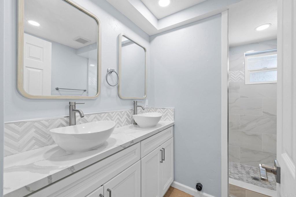 1908 Washington Street, Unit 2 Lemon Grove, CA 91945 - Photo 11 of 26 a bathroom with a sink and a mirror