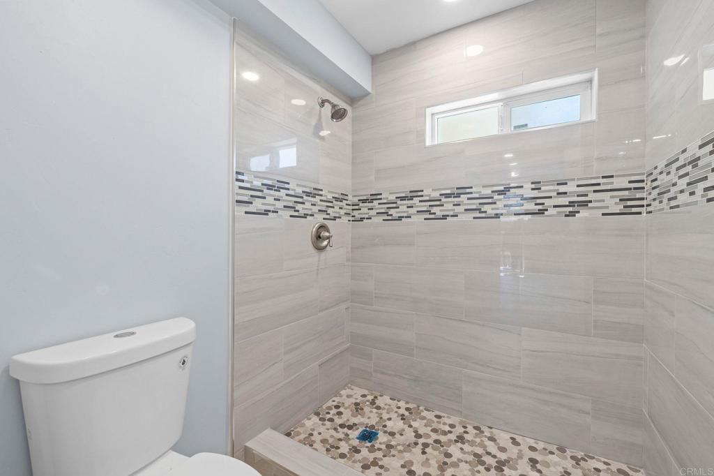 1908 Washington Street, Unit 2 Lemon Grove, CA 91945 - Photo 12 of 26 a bathroom with a shower a toilet and a shower