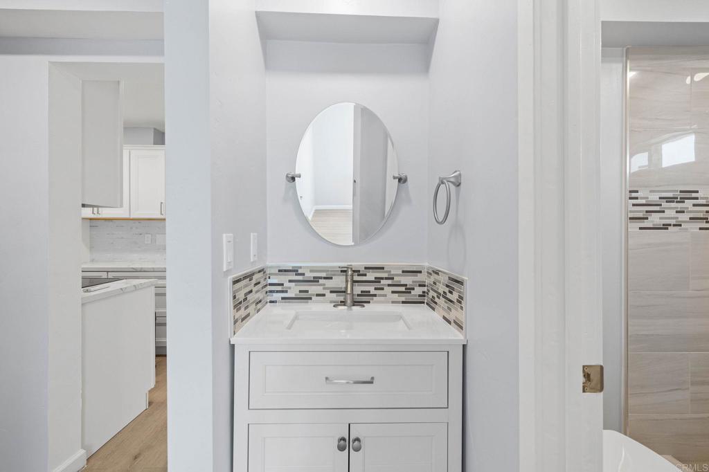1908 Washington Street, Unit 2 Lemon Grove, CA 91945 - Photo 14 of 26 a bathroom with a sink vanity and a mirror