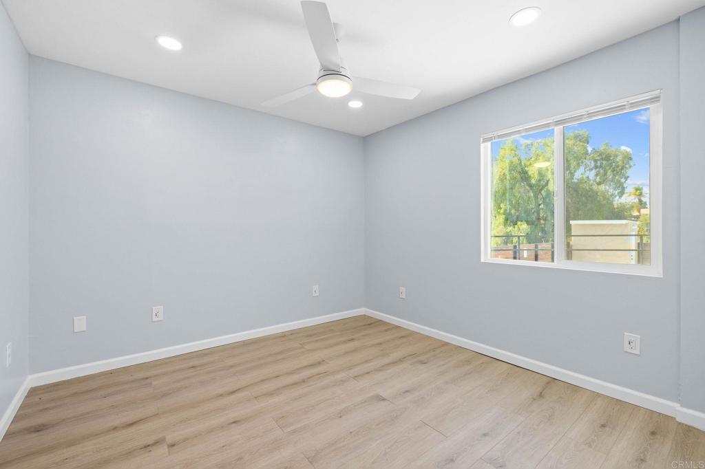 1908 Washington Street, Unit 2 Lemon Grove, CA 91945 - Photo 17 of 26 an empty room with wooden floor and windows