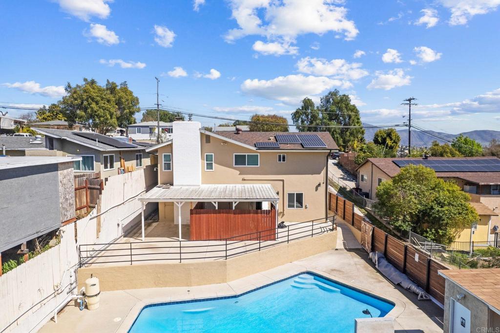 1908 Washington Street, Unit 2 Lemon Grove, CA 91945 - Photo 24 of 26 a view of a white building with a swimming pool