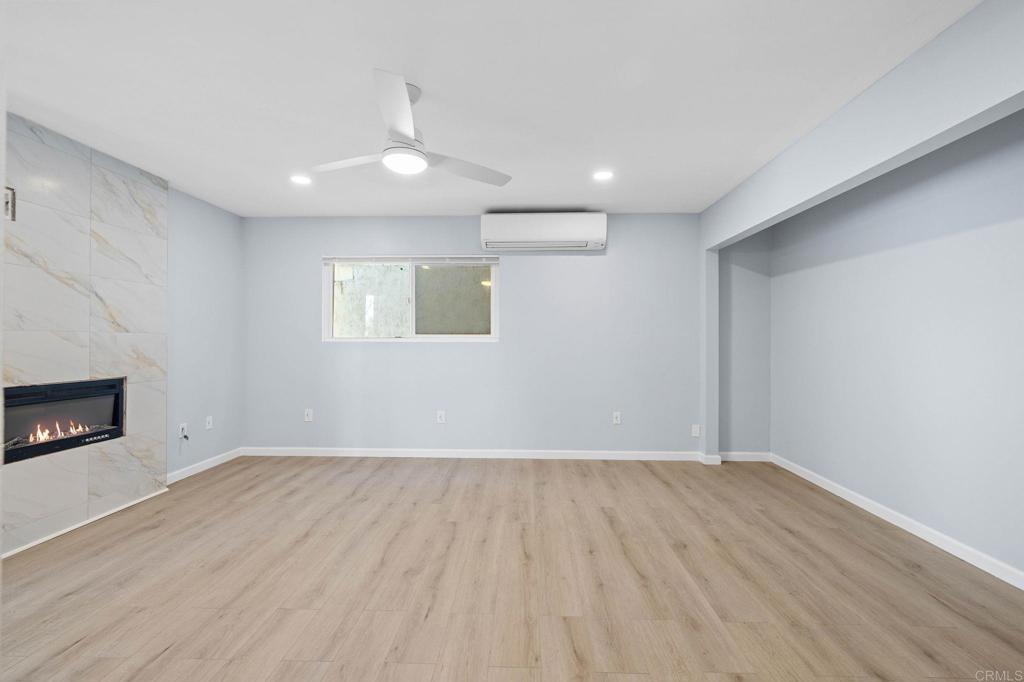 1908 Washington Street, Unit 2 Lemon Grove, CA 91945 - Photo 4 of 26 wooden floor in an empty room with a fireplace