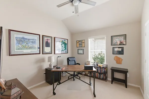 a living room with furniture a rug and a window