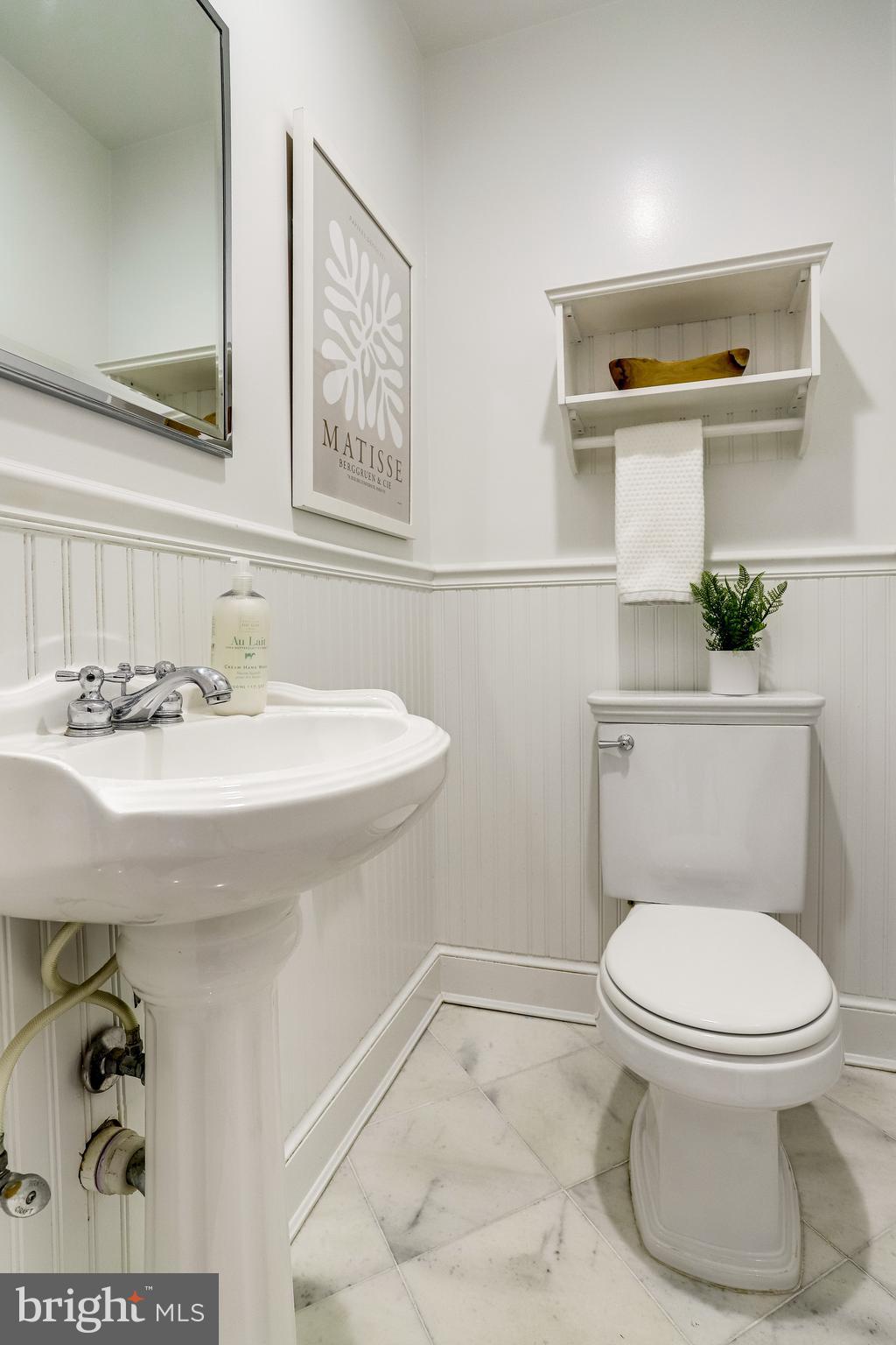 421 First Street Southeast Washington, DC 20003 - Photo 12 of 64 Half bath has wainscoting, marble floor