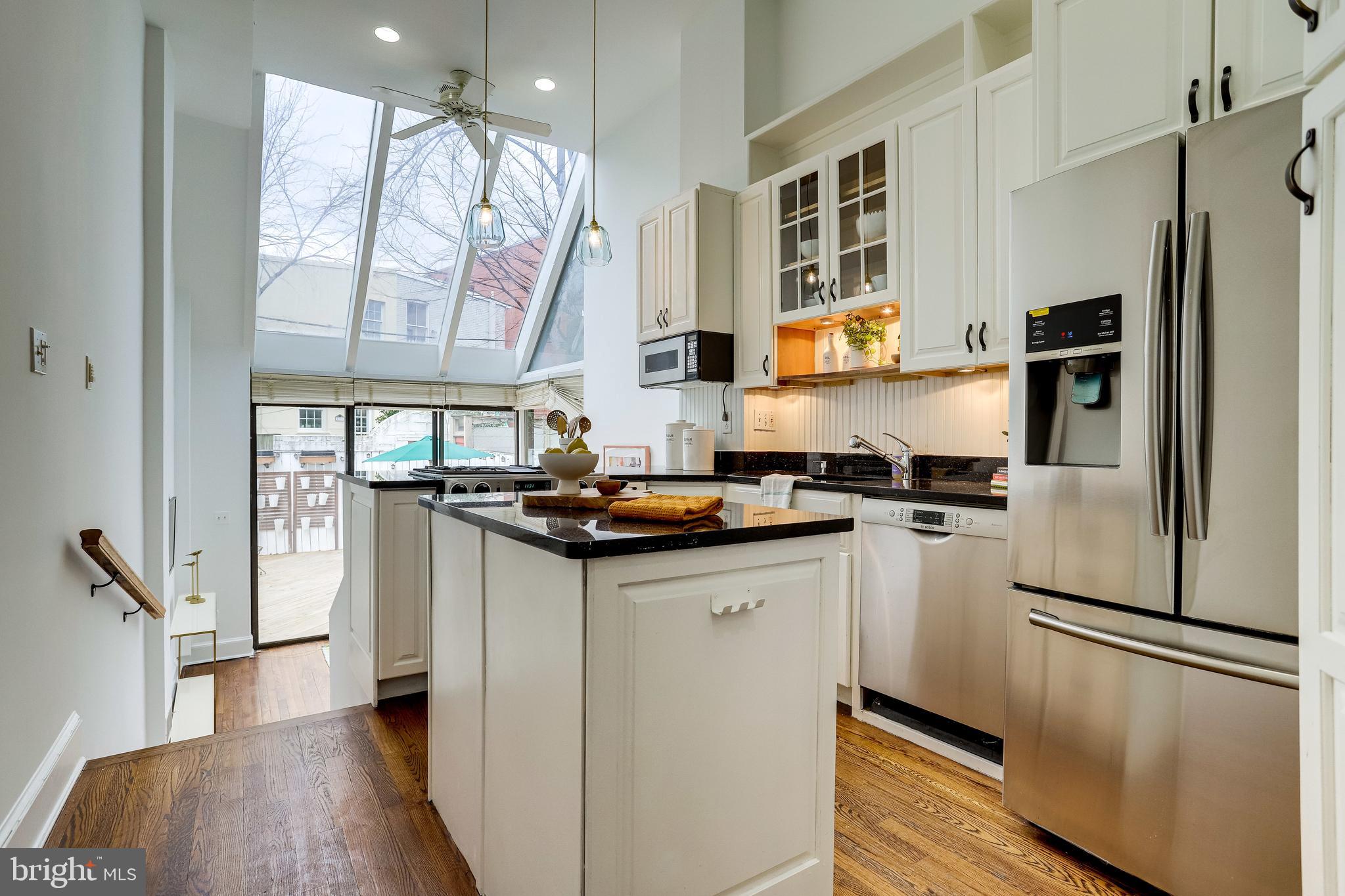 421 First Street Southeast Washington, DC 20003 - Photo 13 of 64 Kitchen w/island overlooks family room