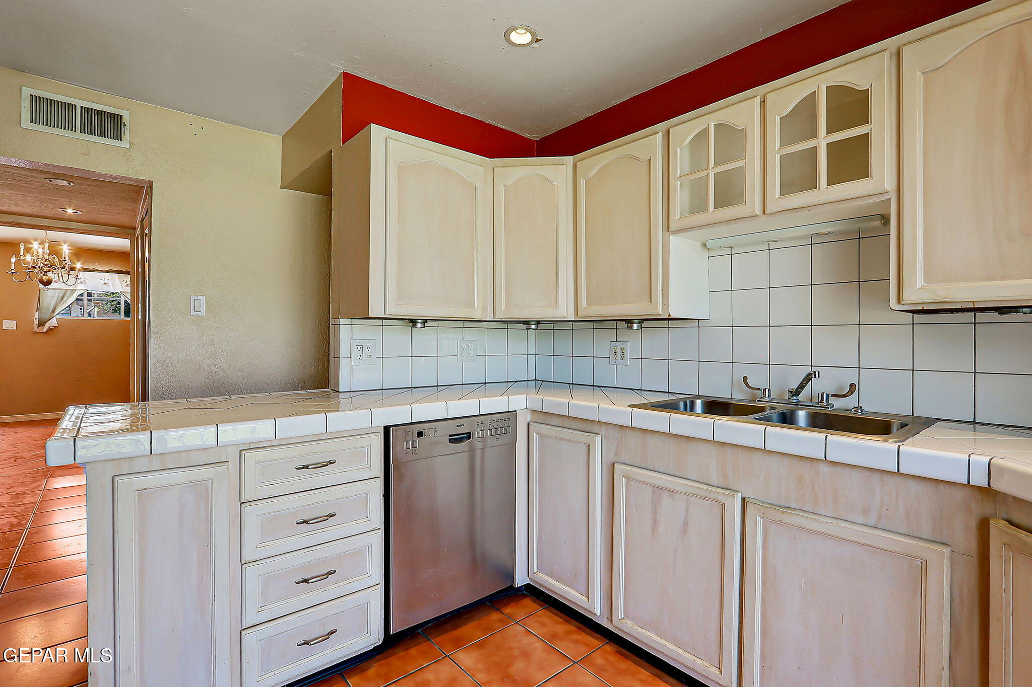 122 North Pendell Road El Paso, TX 79905 - Photo 20 of 62 a kitchen with cabinets appliances a sink and a counter top space