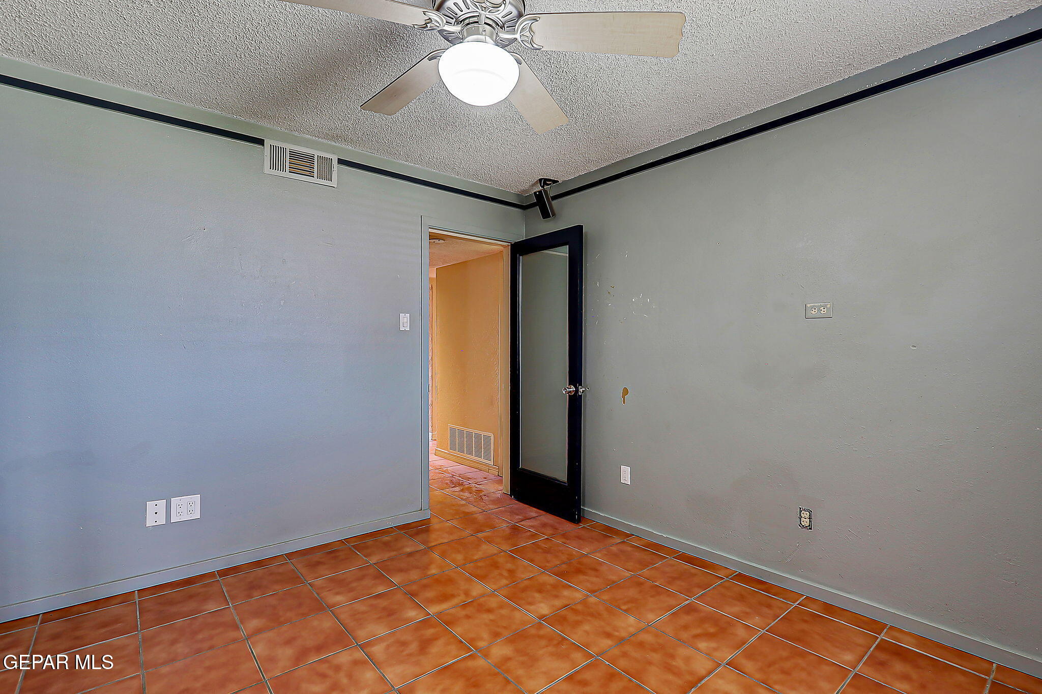 122 North Pendell Road El Paso, TX 79905 - Photo 34 of 62 a view of a room with a chandelier fan and wooden floor