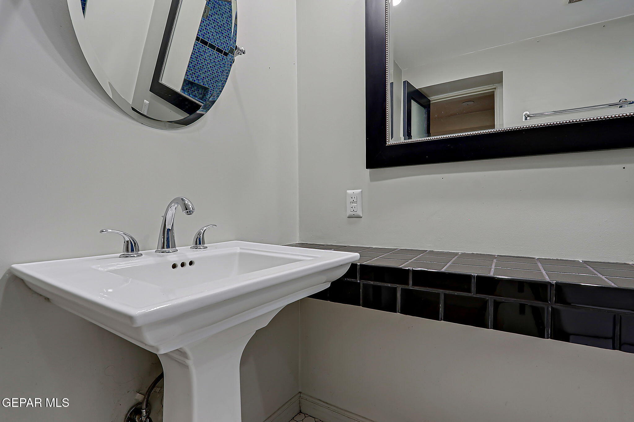 122 North Pendell Road El Paso, TX 79905 - Photo 44 of 62 a bathroom with a sink and a mirror
