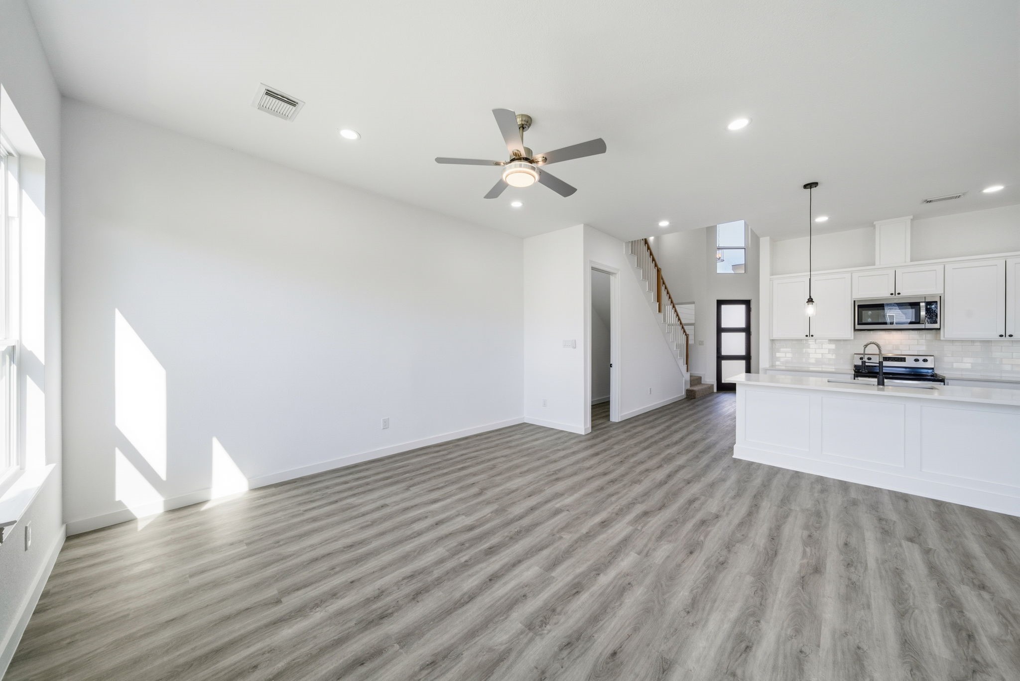 111 Capetown Way Conroe, TX 77356 - Photo 15 of 37 a view of a kitchen with wooden floor and a kitchen