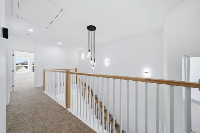 a view of a hallway with stairs