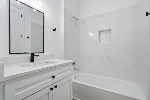 a bathroom with a sink and a bathtub