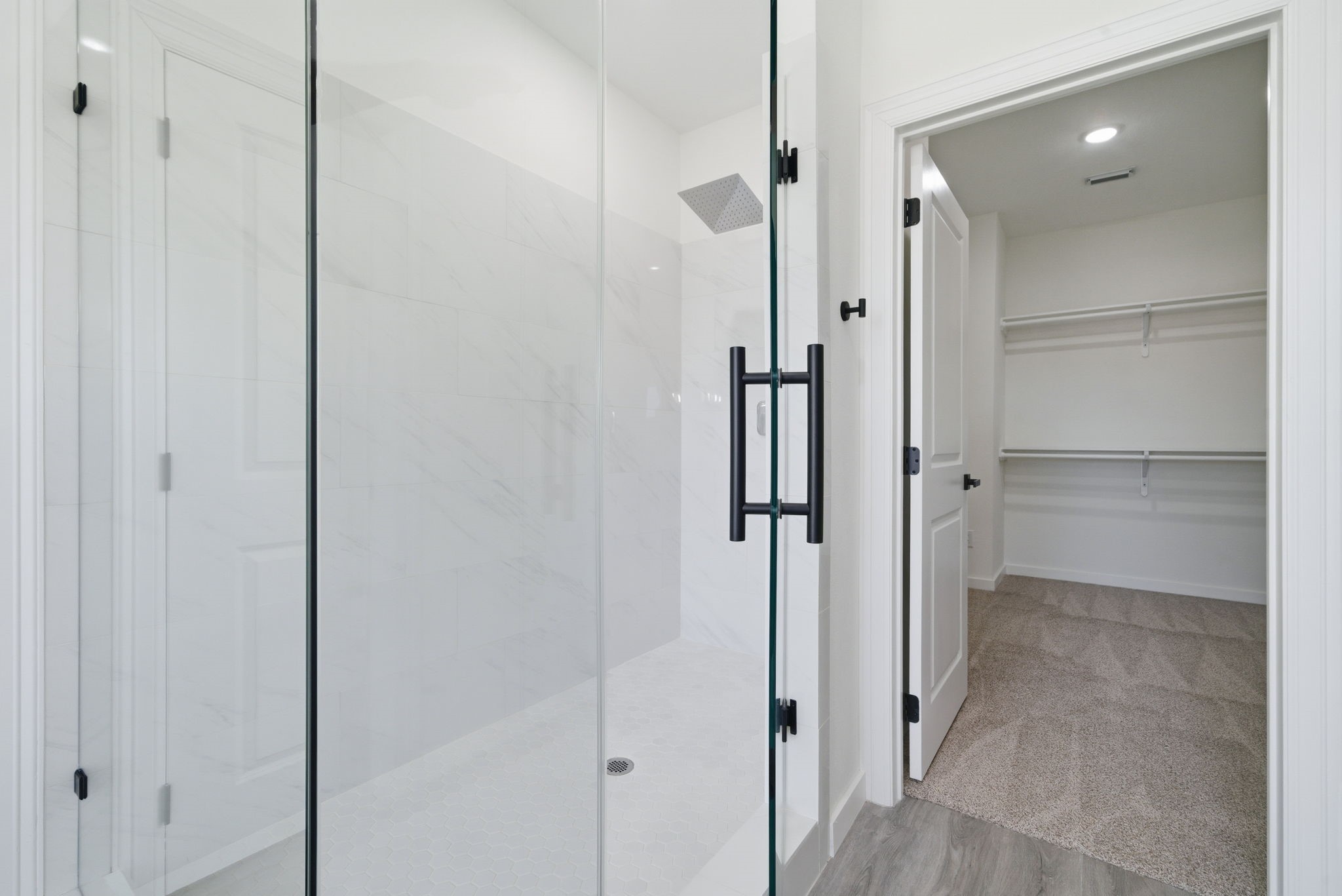 111 Capetown Way Conroe, TX 77356 - Photo 28 of 37 a bathroom with a shower and a glass door