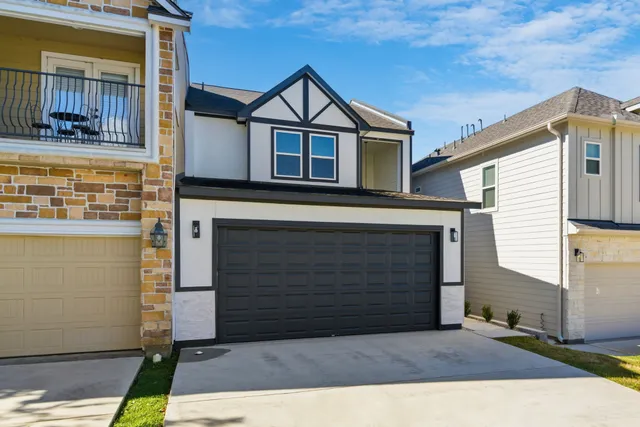 a front view of a house with garage
