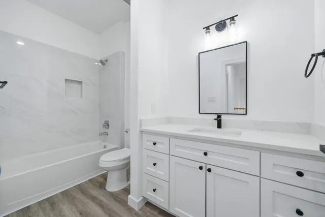 a bathroom with a toilet sink and bathtub