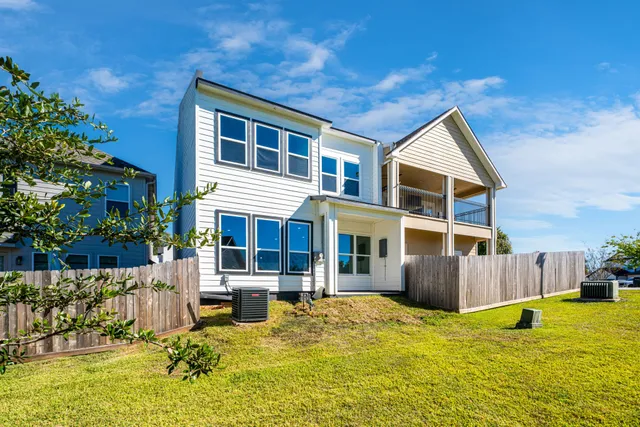 a swimming pool with outdoor seating and yard