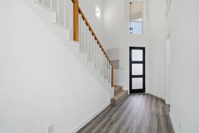 a view of entryway with wooden floor