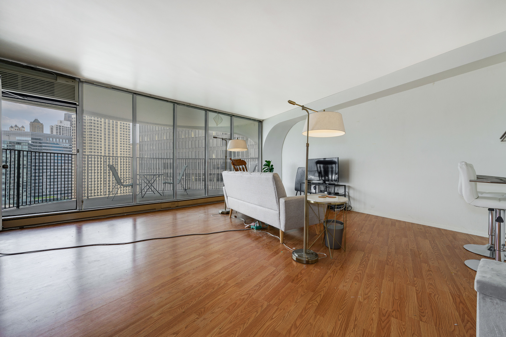 300 North State Street, Unit 3129 Chicago, IL 60654 - Photo 2 of 19 a workspace with wooden floor