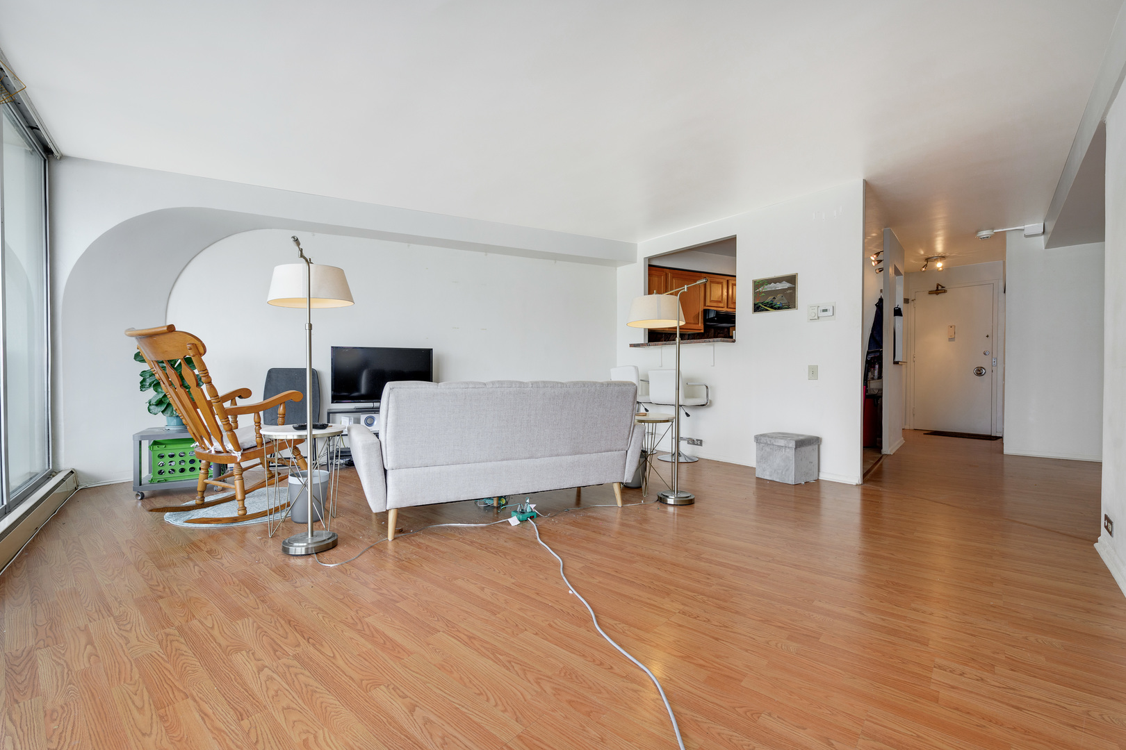 300 North State Street, Unit 3129 Chicago, IL 60654 - Photo 4 of 19 a living room with furniture and a flat screen tv