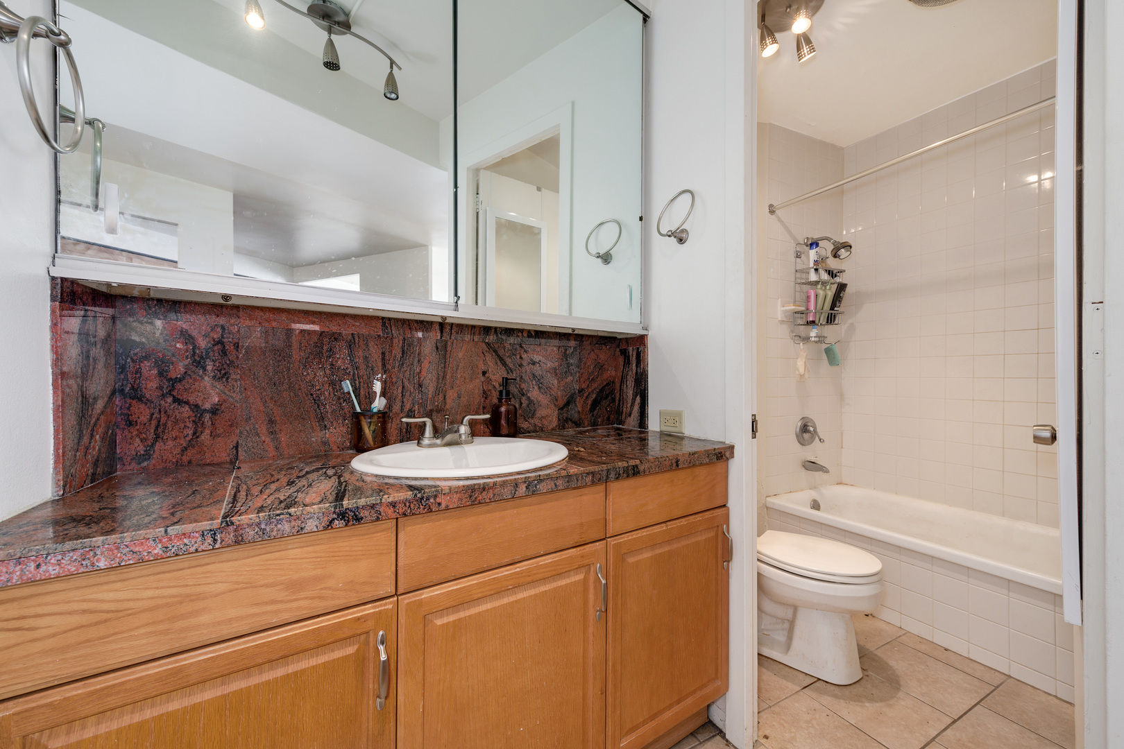 300 North State Street, Unit 3129 Chicago, IL 60654 - Photo 9 of 19 a bathroom with a sink a toilet and shower