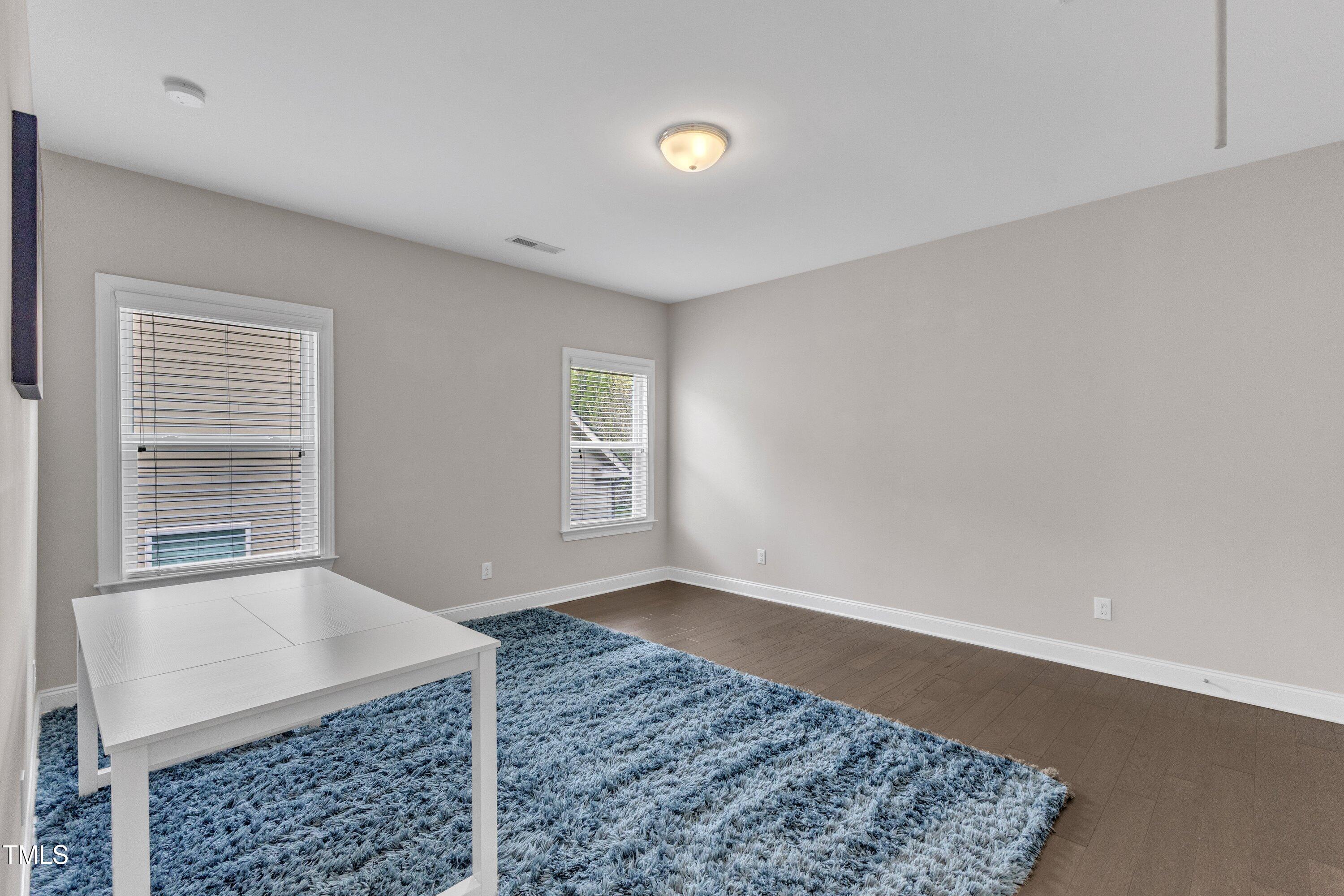8121 Greys Landing Way Raleigh, NC 27615 - Photo 48 of 95 an empty room with windows