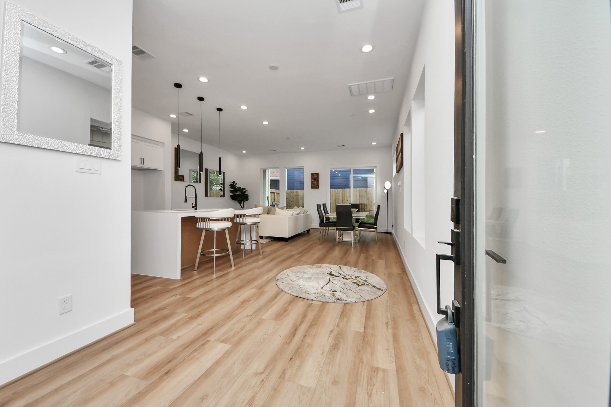 505 Middle Street Houston, TX 77003 - Photo 3 of 46 Welcome to your new home: step into a bright, open-concept space featuring sleek hardwood floors, a modern kitchen with chic pendant lighting, and a cozy living area perfect for entertaining.