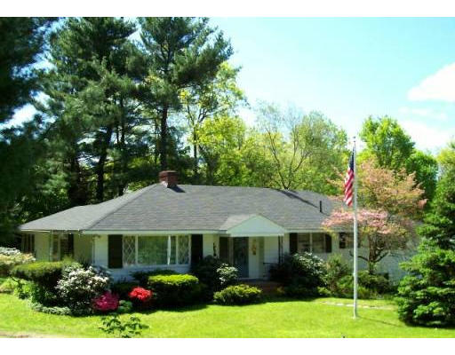 7 Wingate Road Lexington, MA 02421 - Photo 1 of 8 a front view of a house with garden