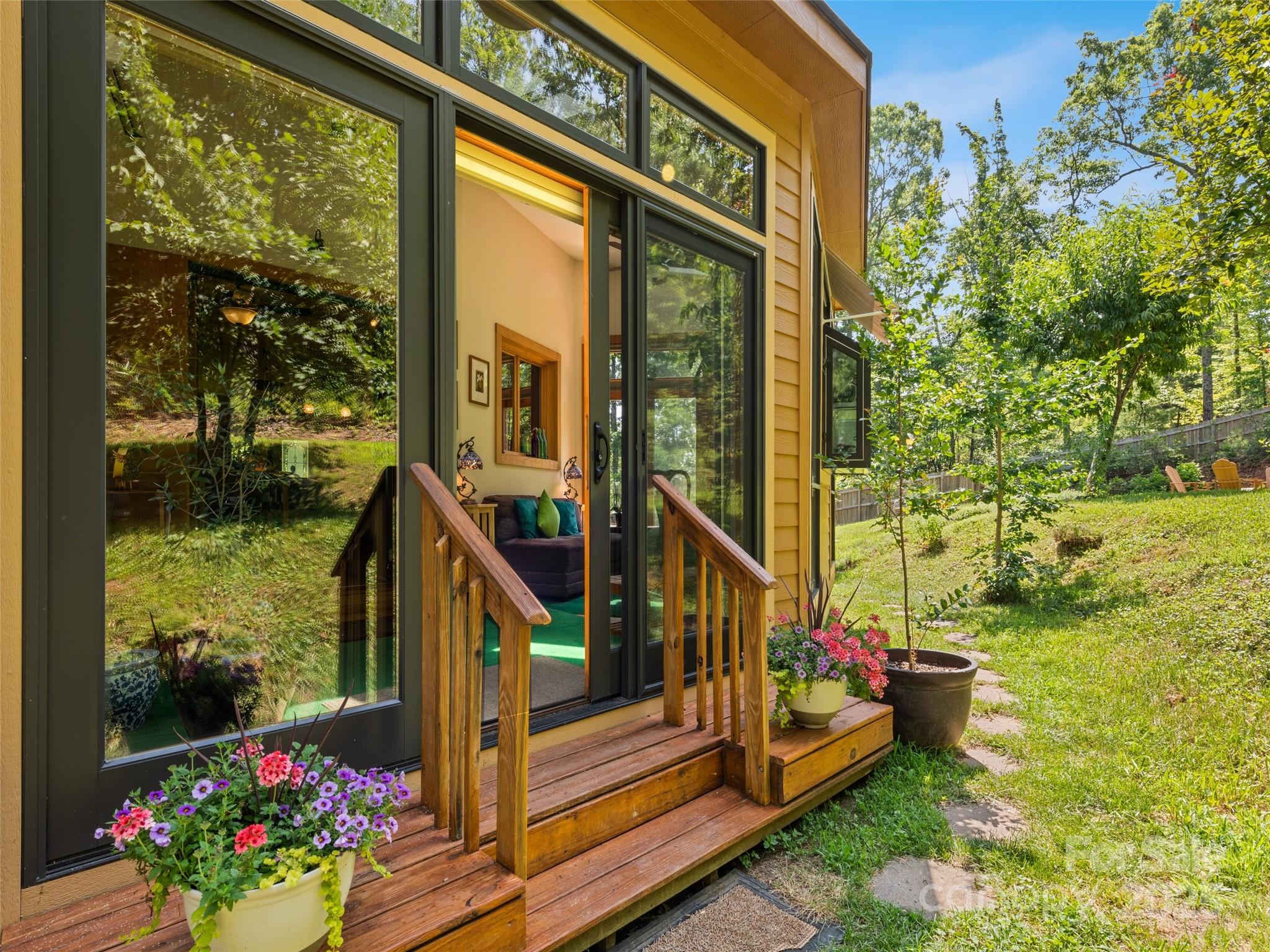 2675 Holbert Cove Road Saluda, NC 28773 - Photo 15 of 48 a view of a balcony with flower plants