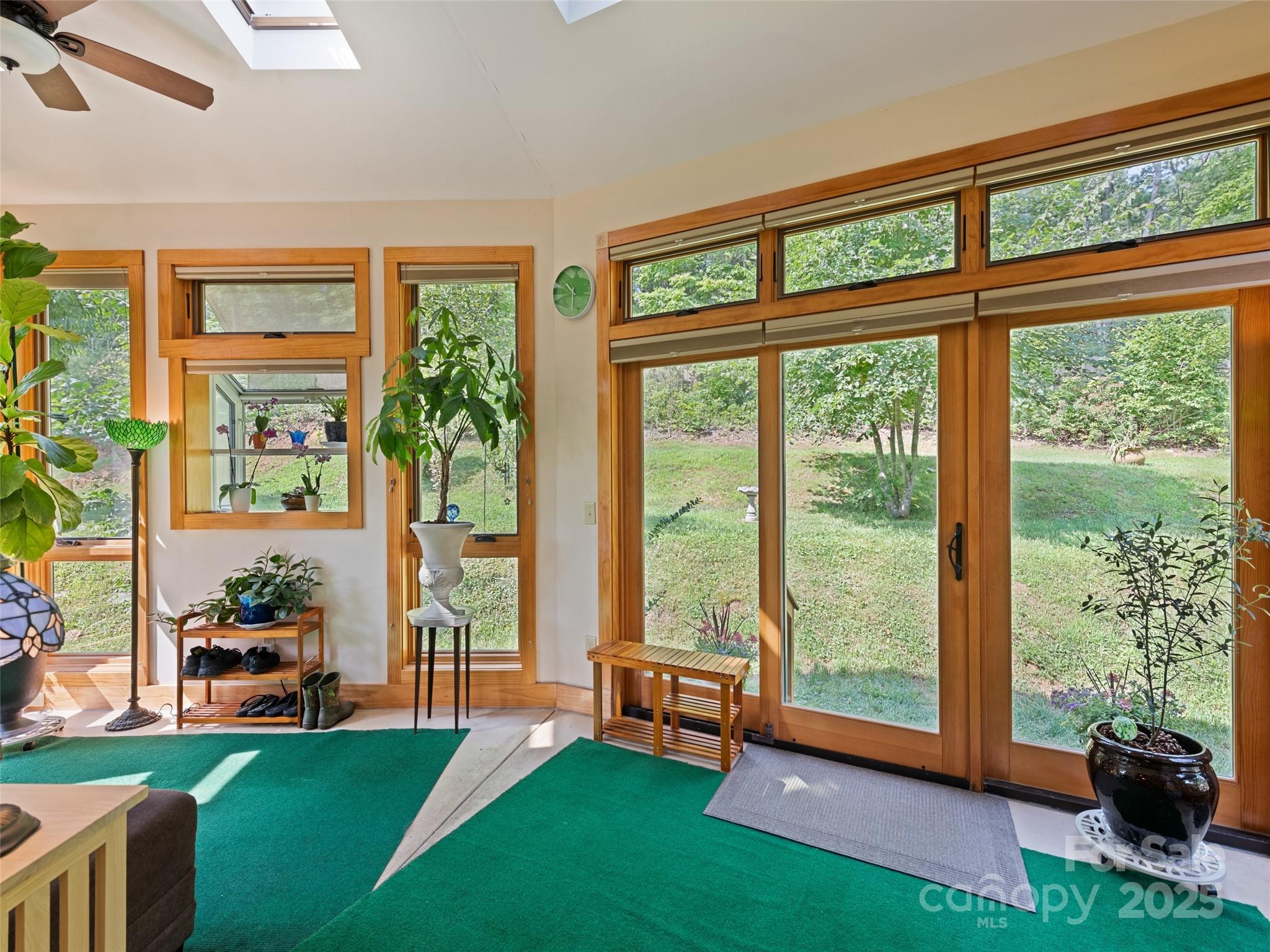 2675 Holbert Cove Road Saluda, NC 28773 - Photo 16 of 48 a room with furniture and a large window