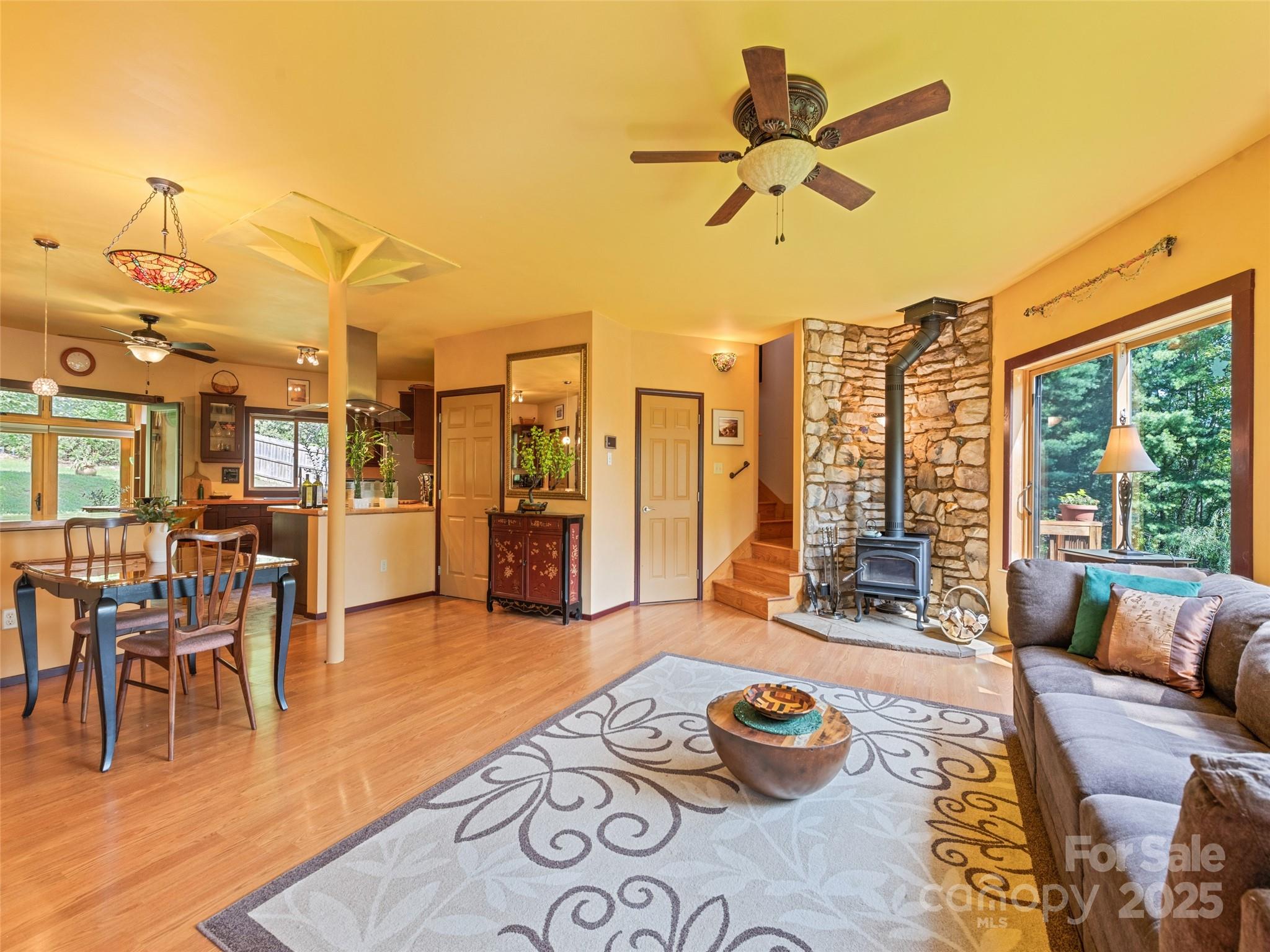 2675 Holbert Cove Road Saluda, NC 28773 - Photo 20 of 48 a living room with furniture and a large window