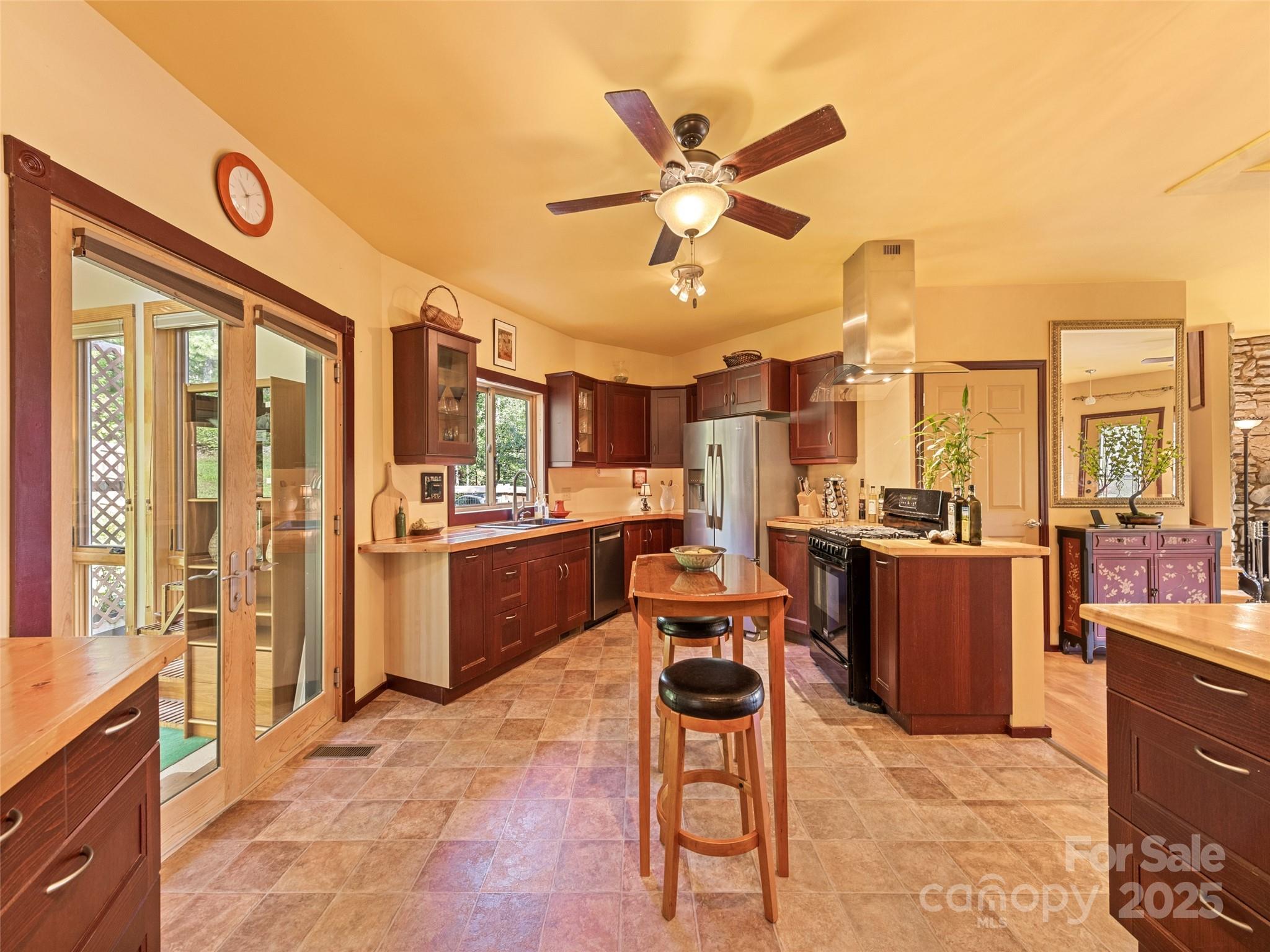 2675 Holbert Cove Road Saluda, NC 28773 - Photo 23 of 48 a living room with stainless steel appliances kitchen island granite countertop furniture and a kitchen view