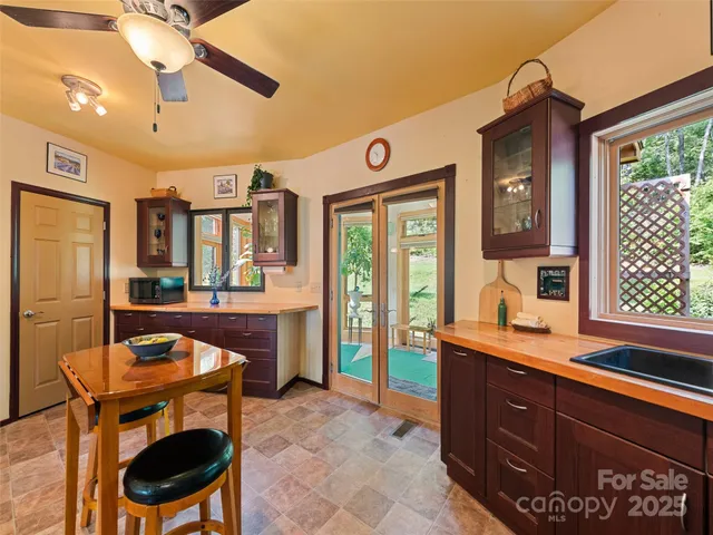 a living room with furniture a dining table and chairs with wooden floor