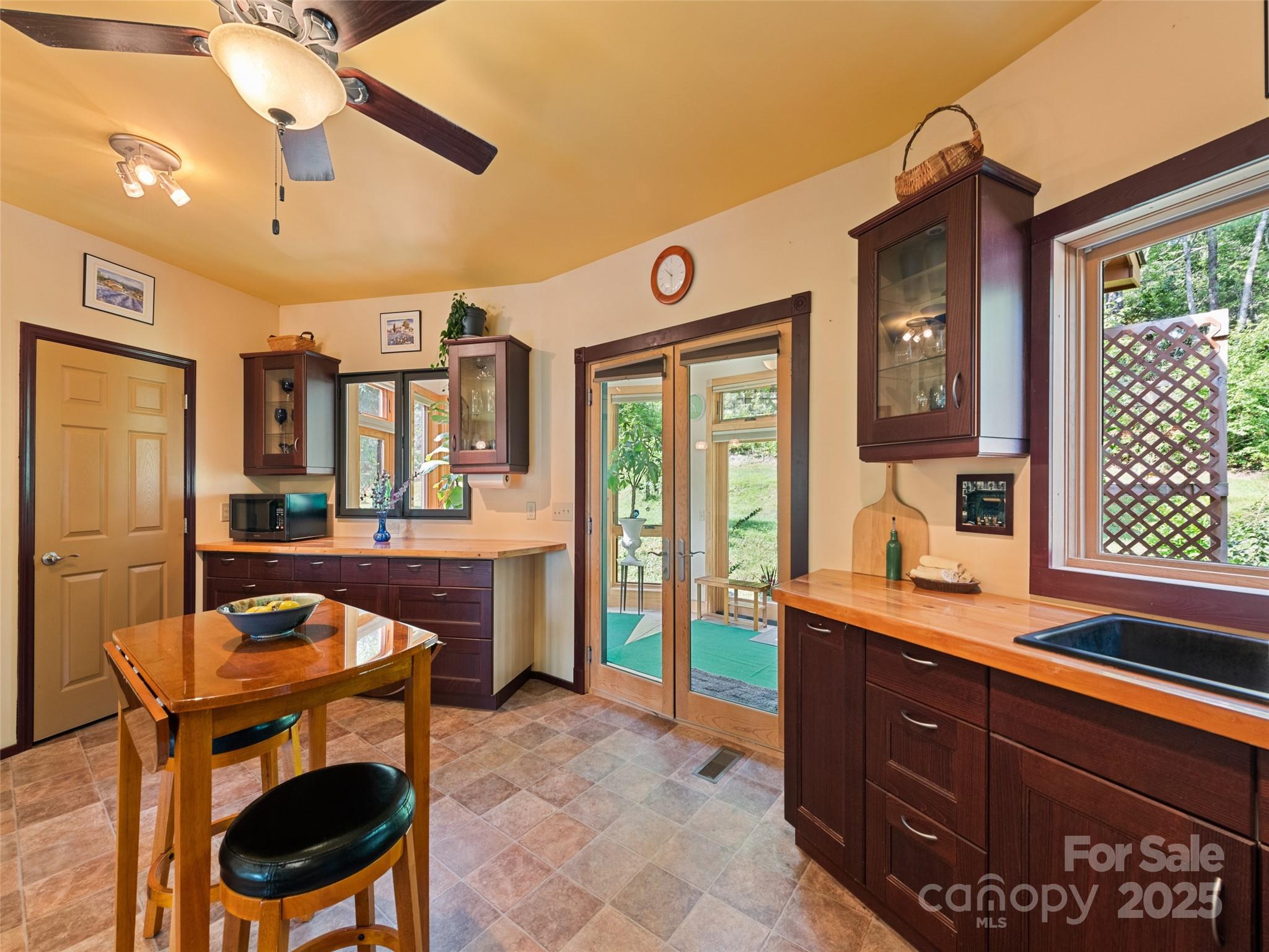 2675 Holbert Cove Road Saluda, NC 28773 - Photo 24 of 48 a living room with furniture a dining table and chairs with wooden floor