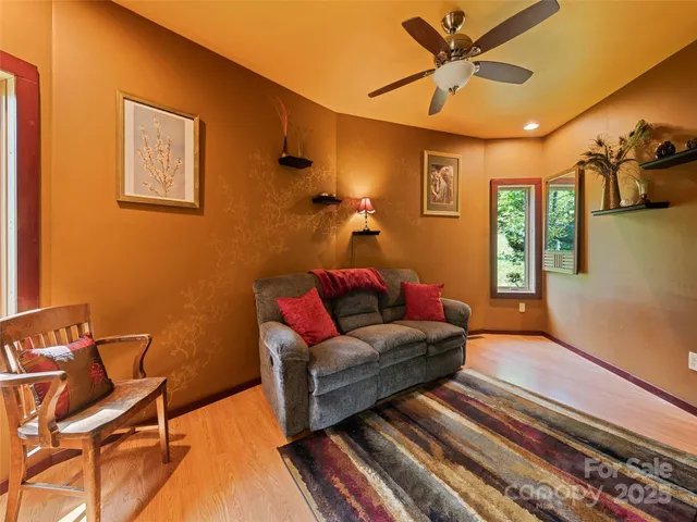 a living room with furniture and a rug