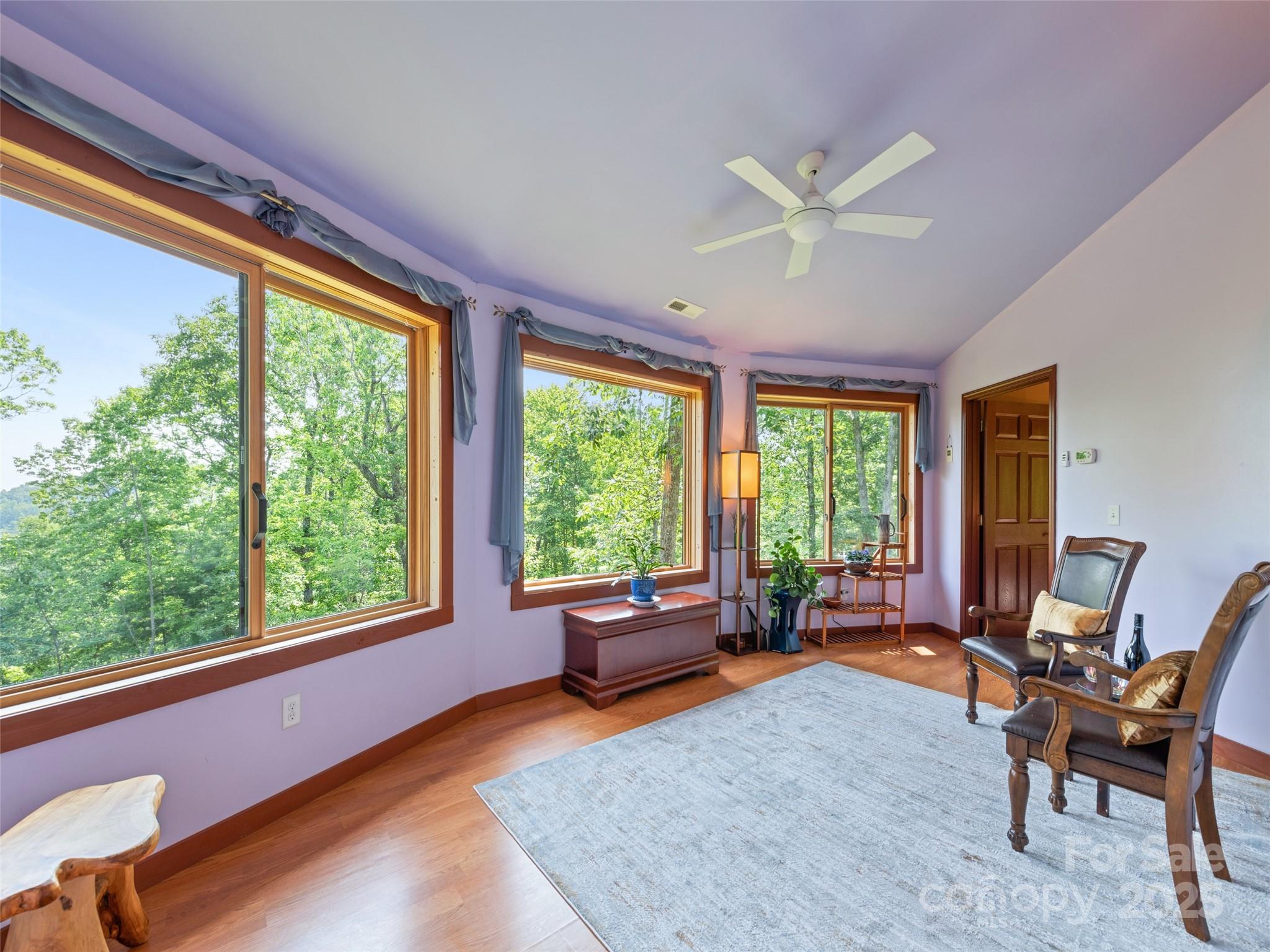 2675 Holbert Cove Road Saluda, NC 28773 - Photo 32 of 48 a living room with furniture and a large window