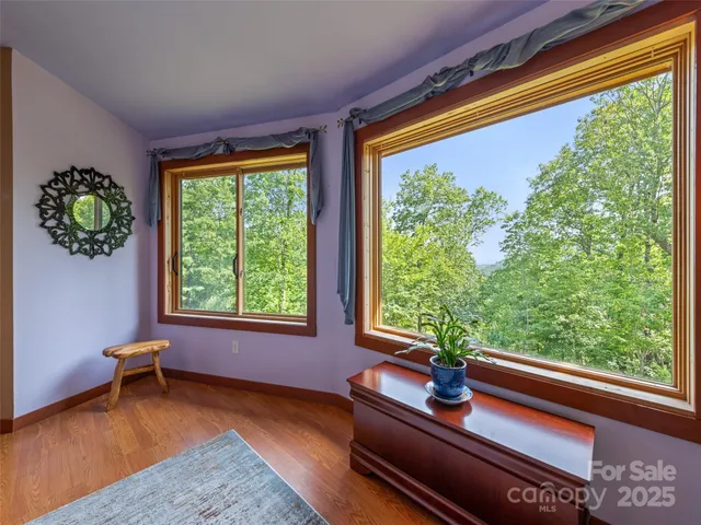 a living room filled with furniture and a window